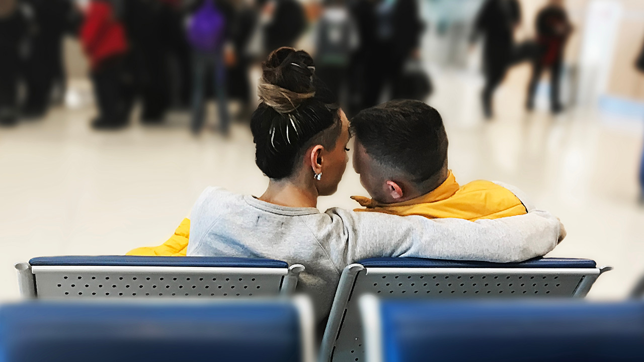 snuggling people sitting