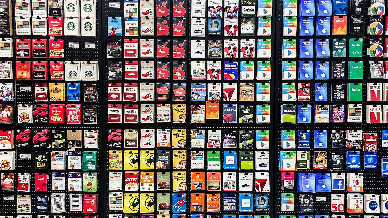gift cards hang on a store display