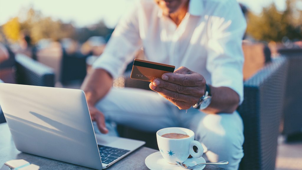 a traveling man pays for coffee