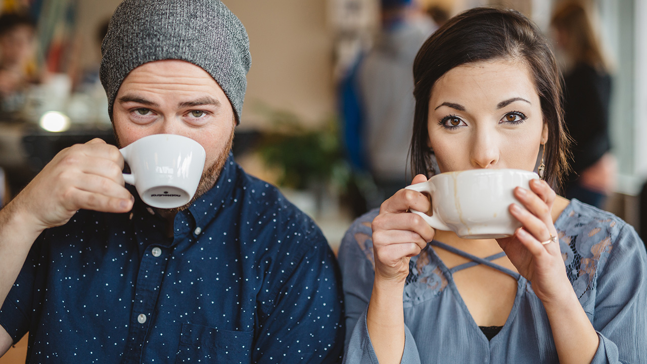 a couple have a cup of coffee