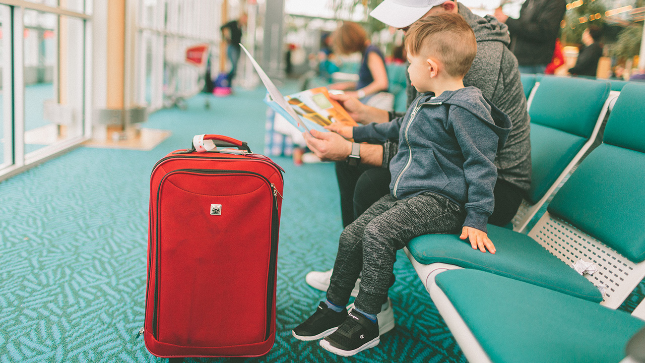 father and son in the airport