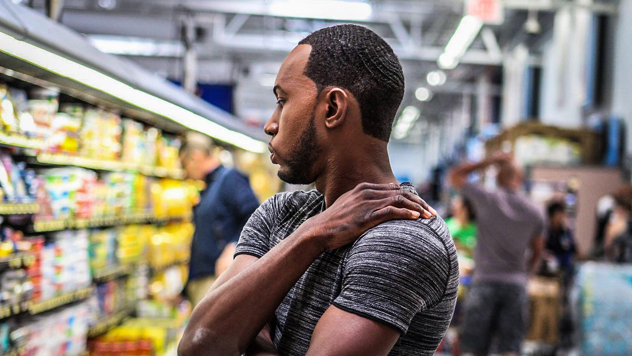 man choosing food at supermarket