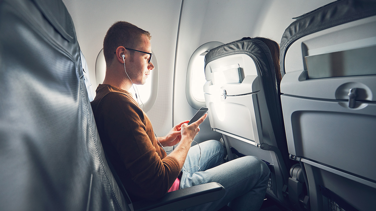 man travels in an airplane