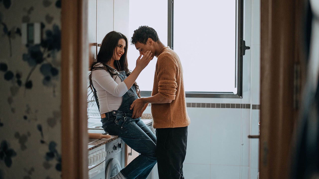 pregnant woman hugs a man