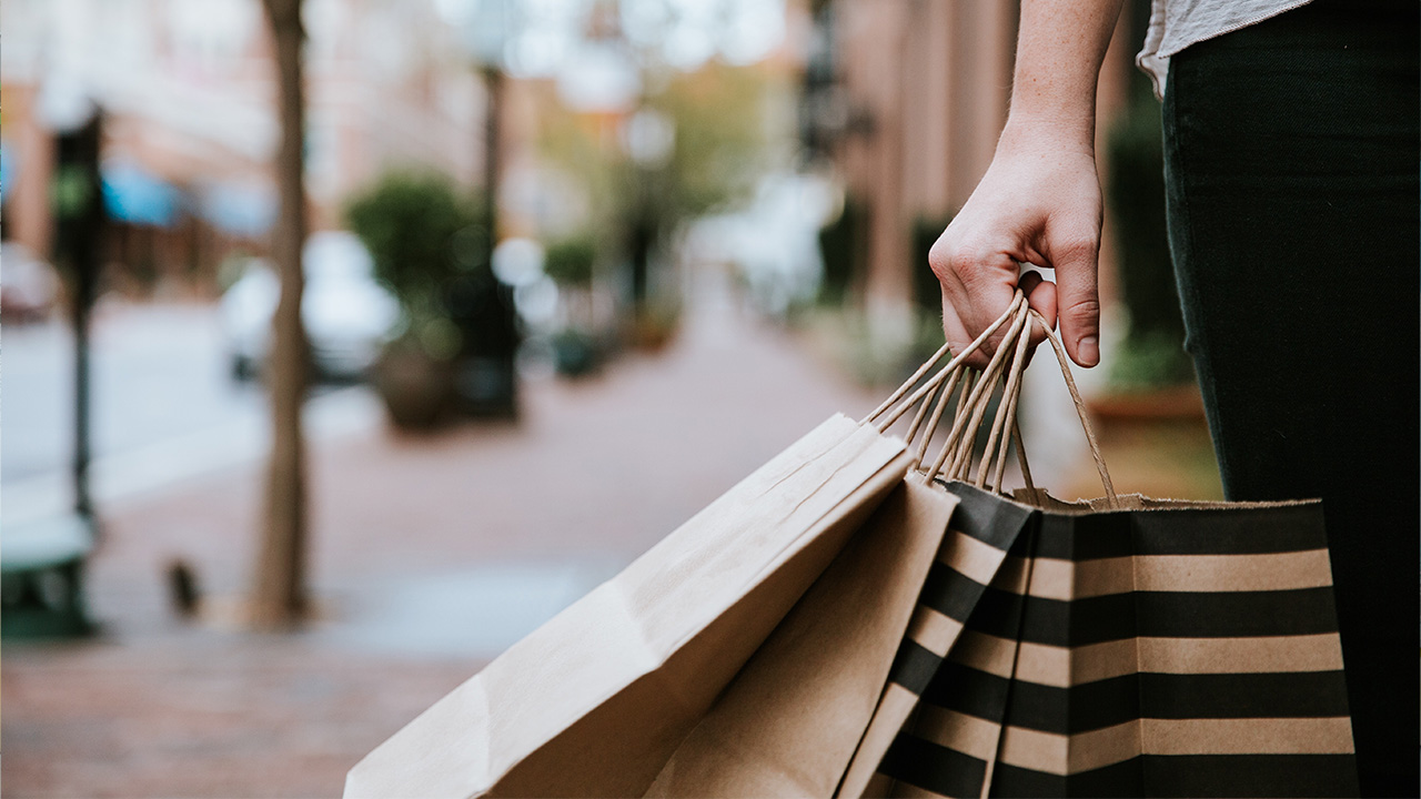 shopper carries shopping bags