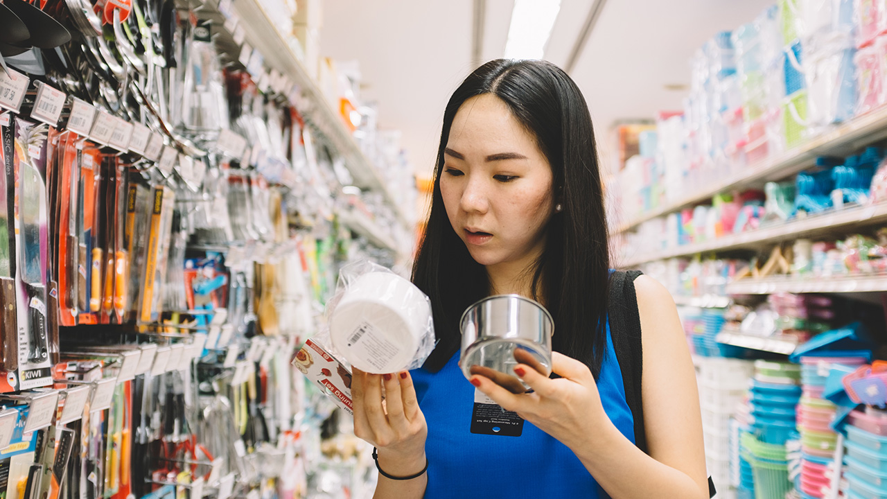 shopper inspecting food at supermarket