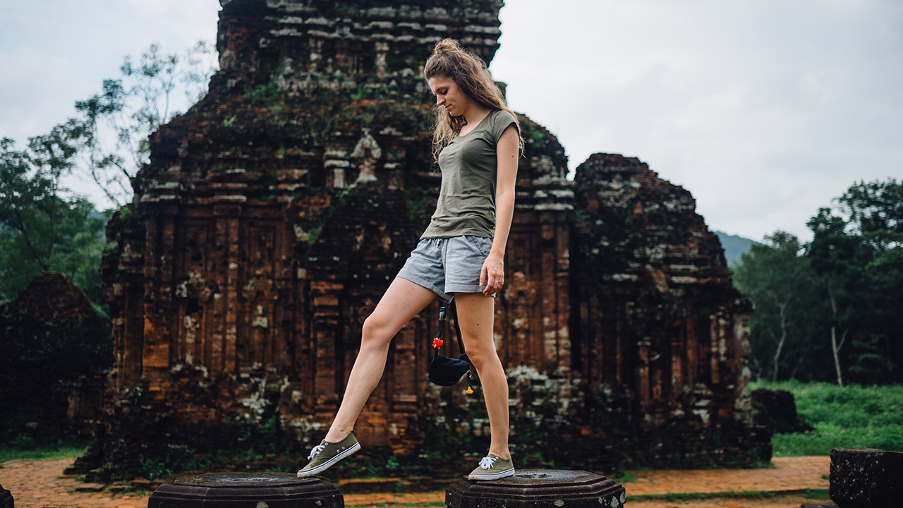 traveler walks among ruins