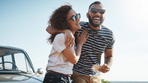 a smiling couple hug