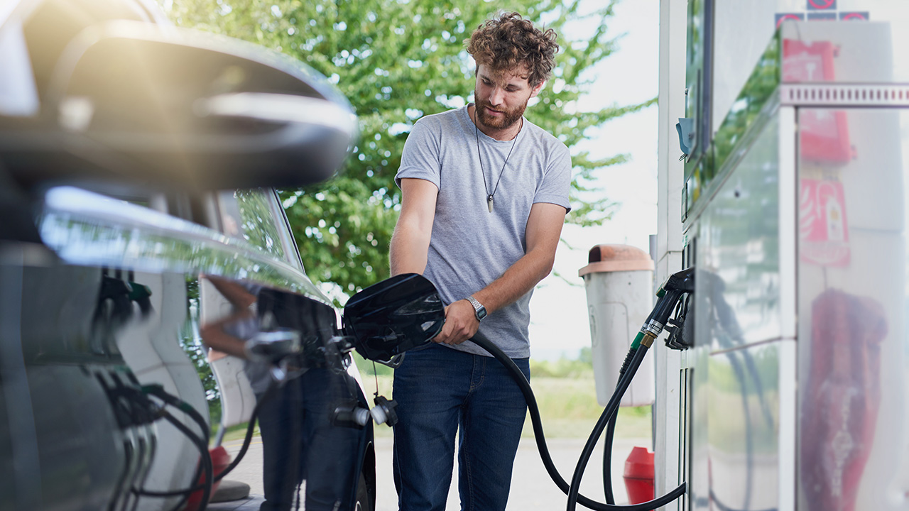 guy uses a gas pump