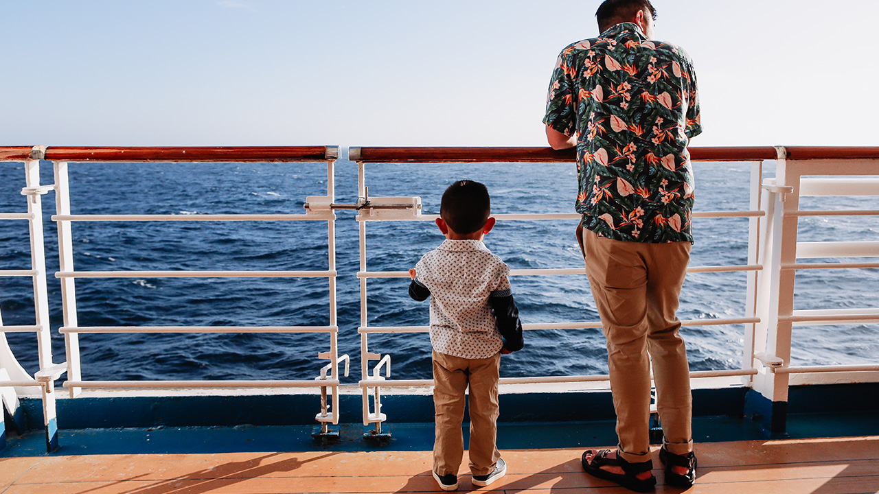 two people look at the ocean