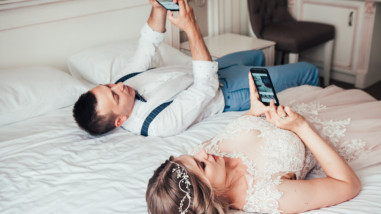 two people take a break from a wedding