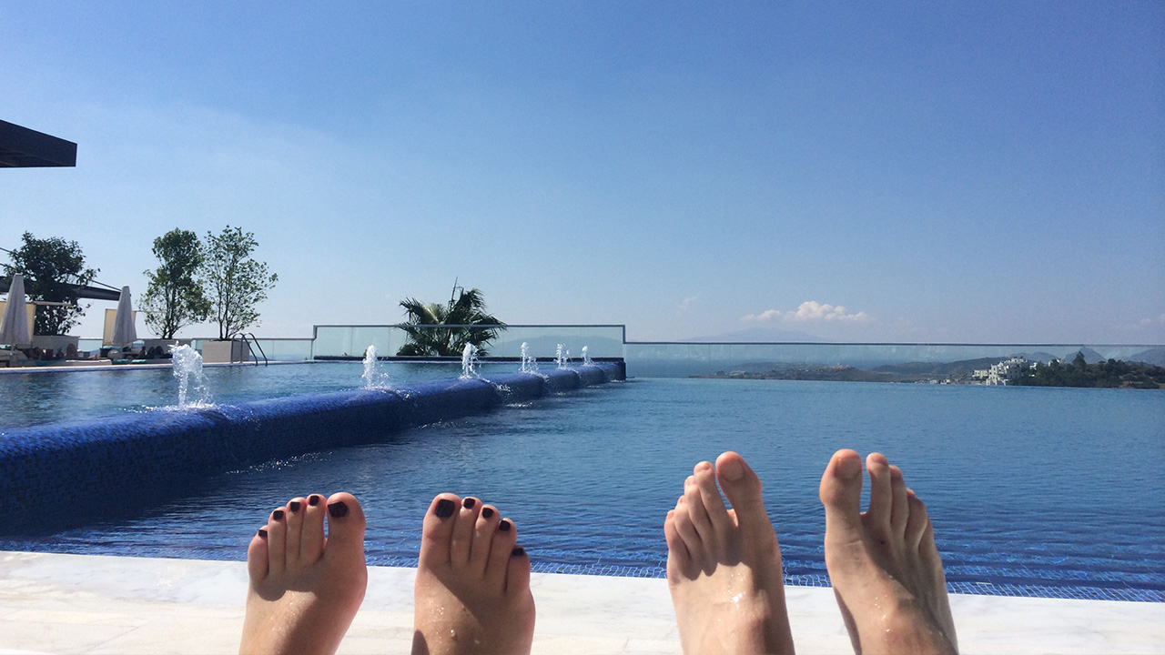 a couple sunbath their feet outside
