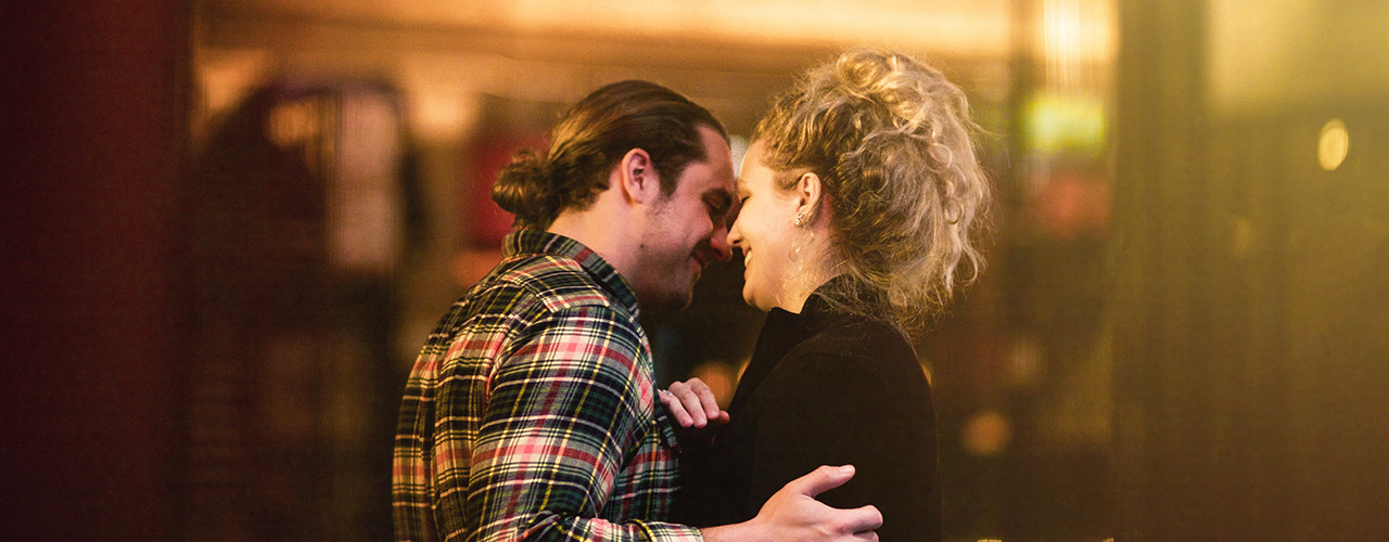 couple being close and intimate smiling