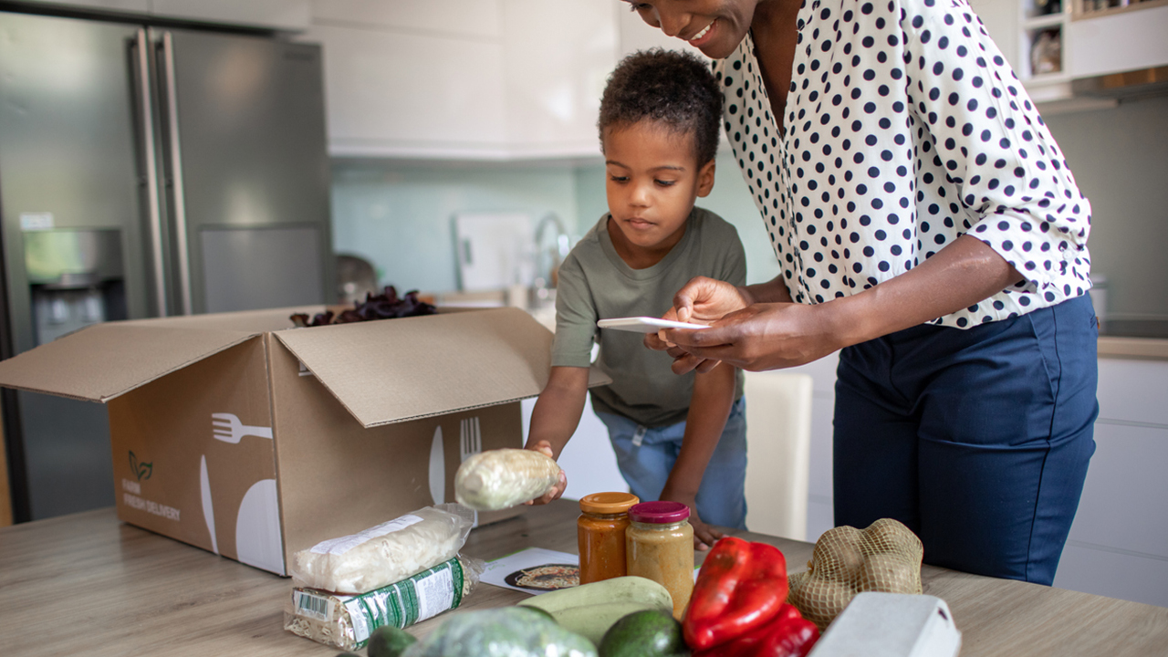 mom-and-child-opening-grocery-delivery