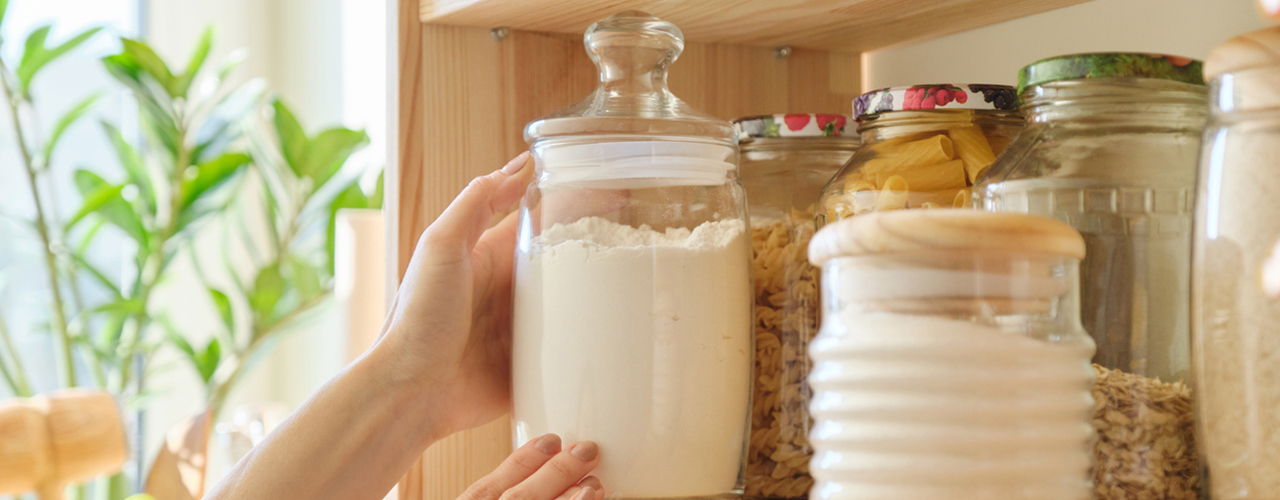 woman-taking-jar-of-flour-from-pantry