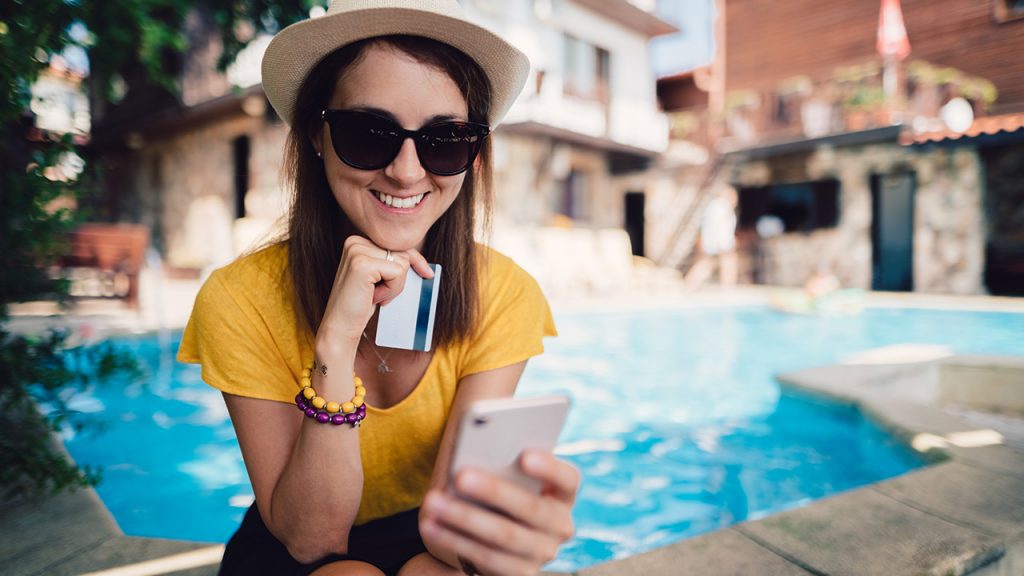 sitting by the pool in sunglasses