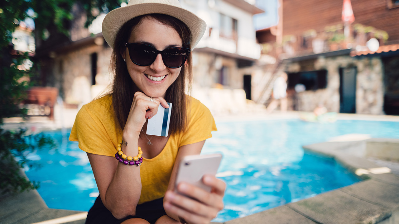 sitting by the pool in sunglasses