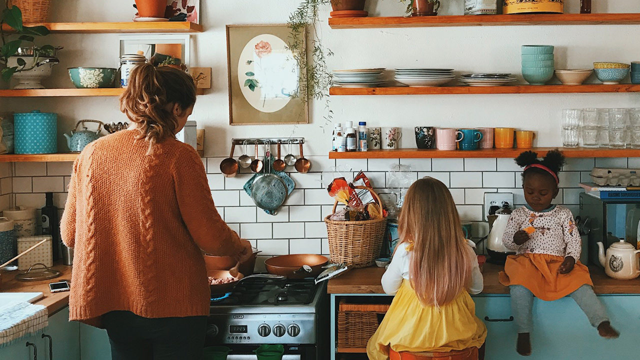 kitchen pantry family cooking together mom and young daughters