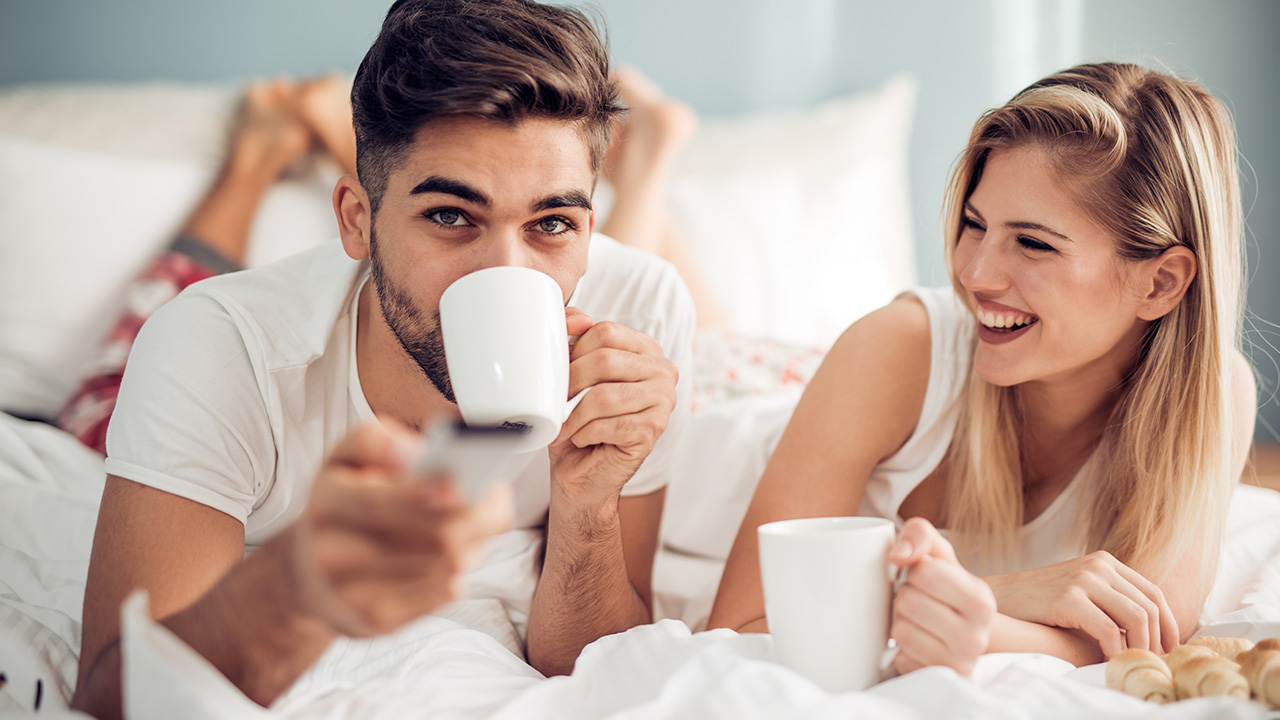 drinking coffee on the bed