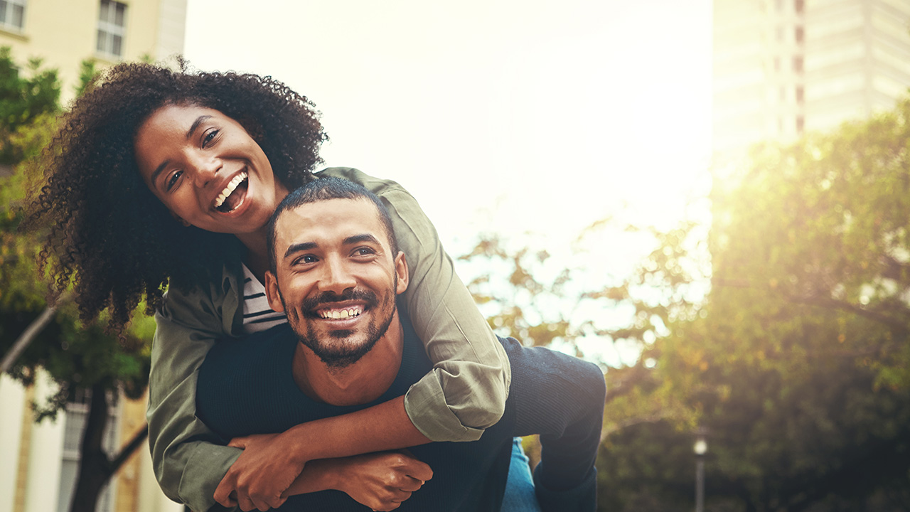 smiling people piggyback