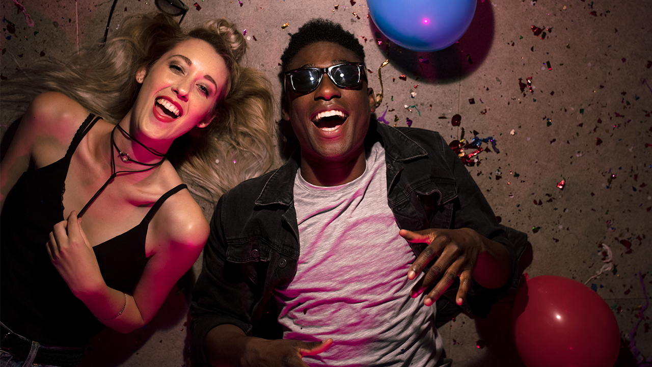 iStock-jacoblund hero couple house party floor smiling