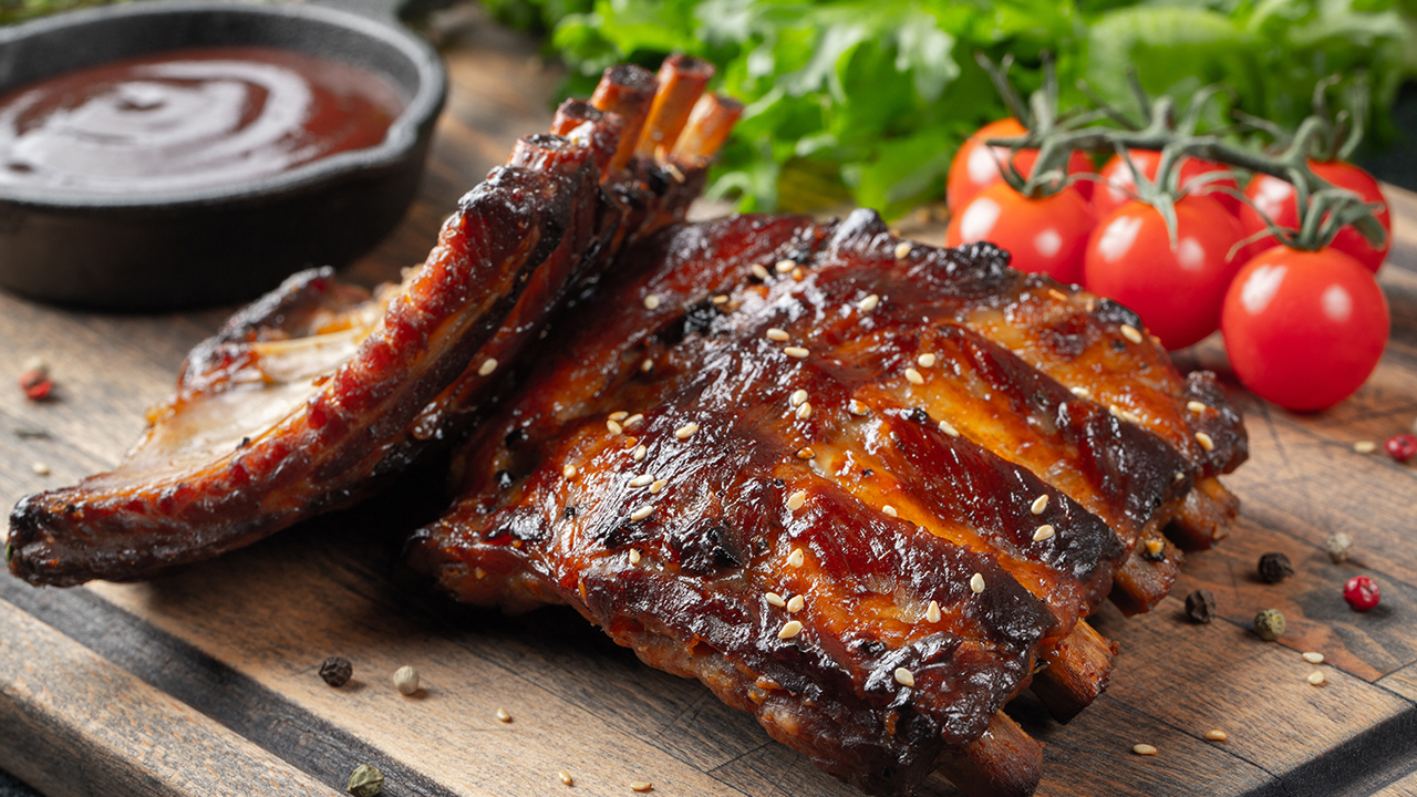 hero iStock-vasiliybudarin rack of ribs tomatoes lettuce bbq