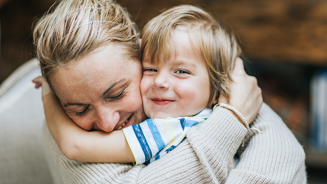 smiling family hugging