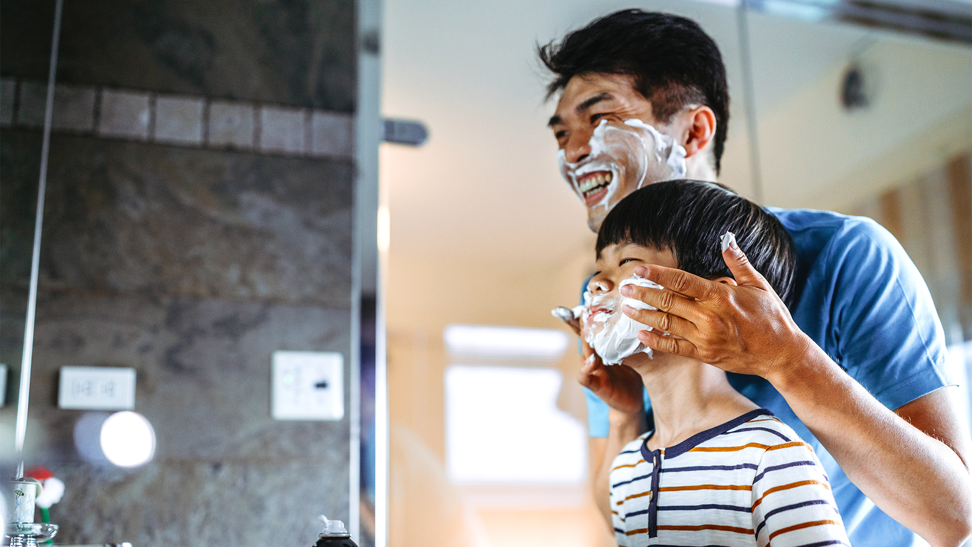 iStock-mixetto father son beard shaving mirror smile