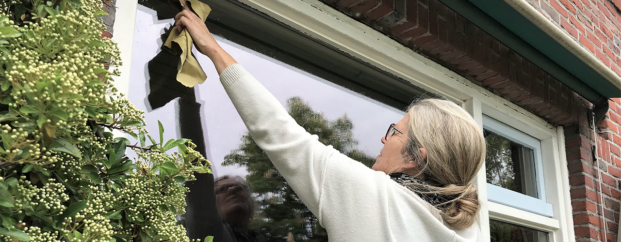 iStock-1147597779 middelveld woman cleaning windows home inbody