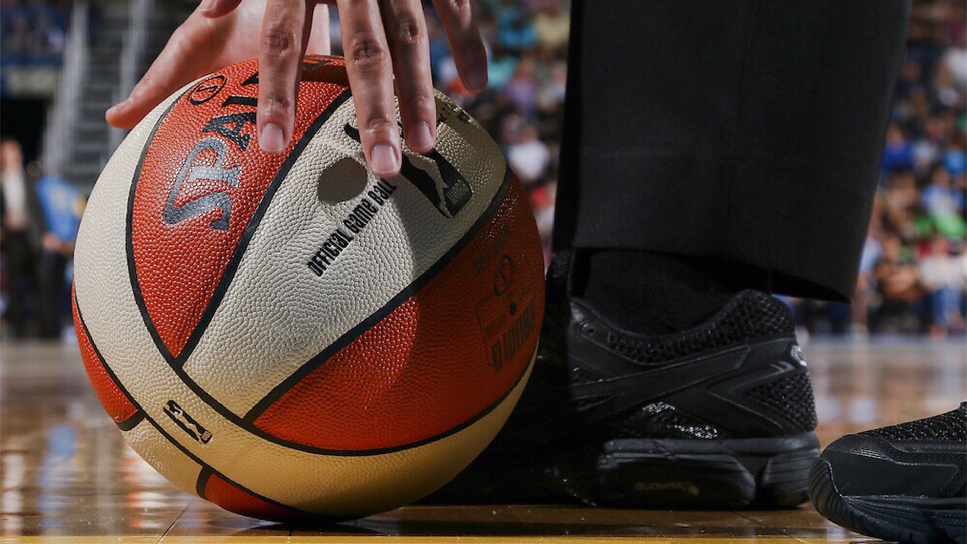 hero-wnba-official-allen-smith-attempts-to-pick-up-the-basketball-prior-to-the-start-of-the-second-half