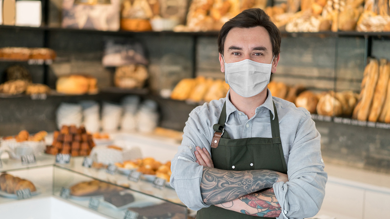 owner standing in front of counter