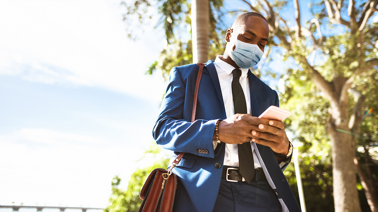 man walks with face mask