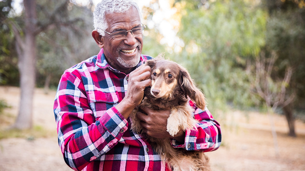 person cuddling a pet