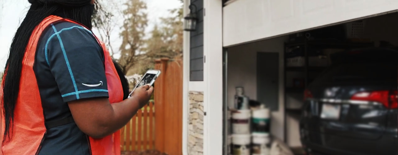 Amazon courier delivery shipper uses Amazon Key to drop off package in garage inbody