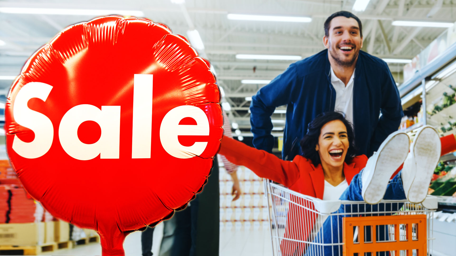 Sale balloon and shoppers excited girl riding in cart man pushing couple grocery store supermarket shopping