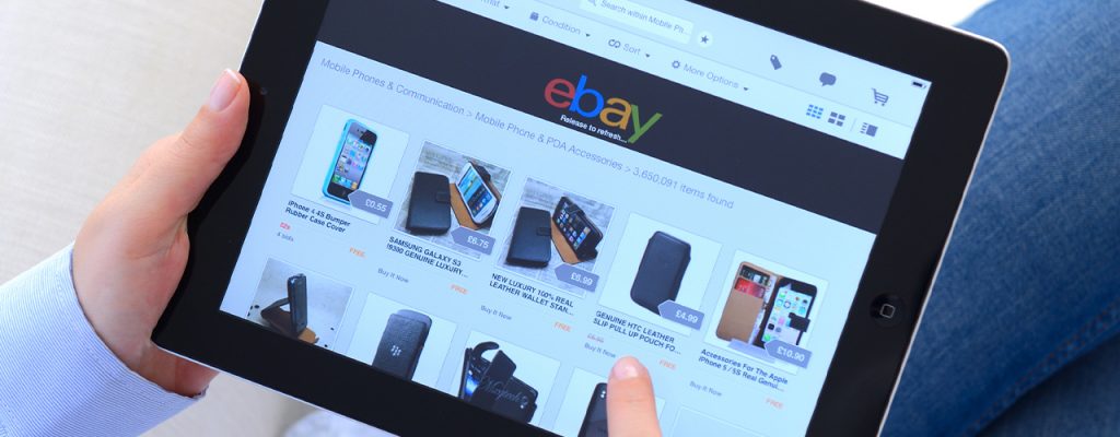 man using ipad looking at ebay