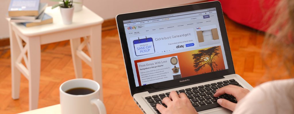 woman using laptop on ebay