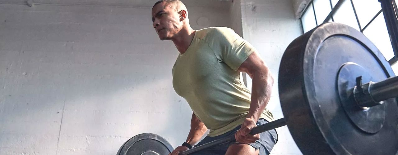man lifting weights
