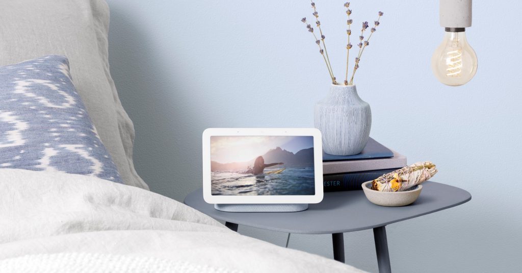 Nest Hub on a light blue bedside table