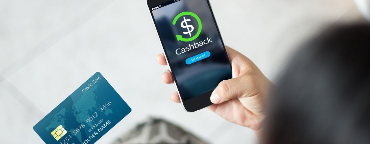 Female hands using mobile phone and holding credit card