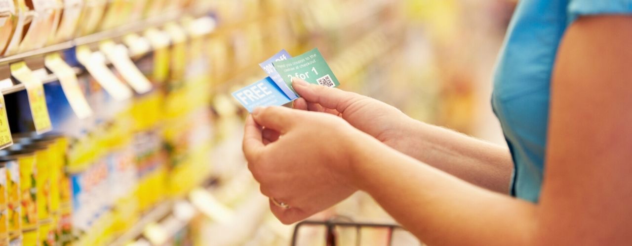 woman using coupons at store