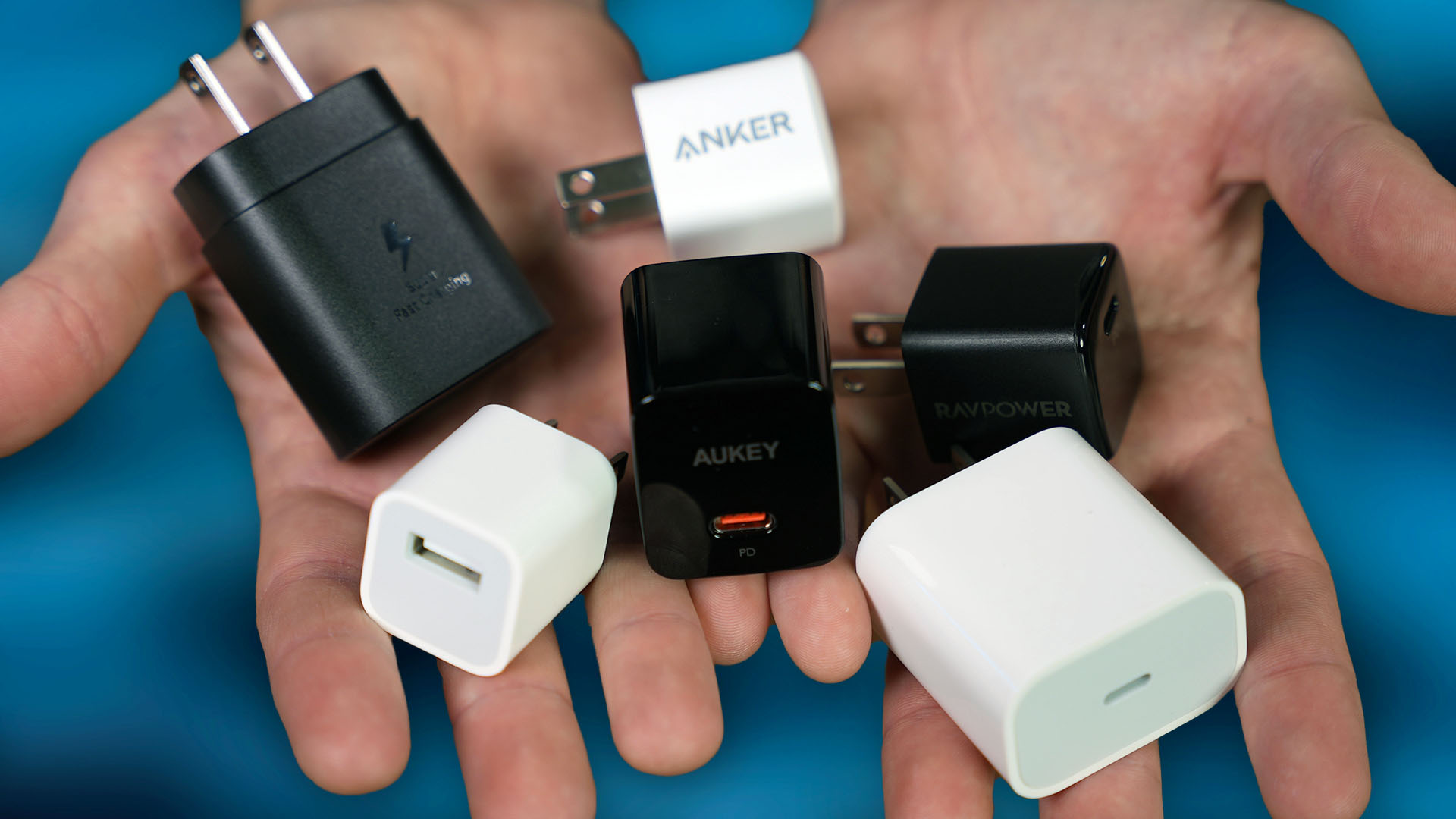 one charger to rule them all. fast chargers 20w charging bricks power adapters in hands hero