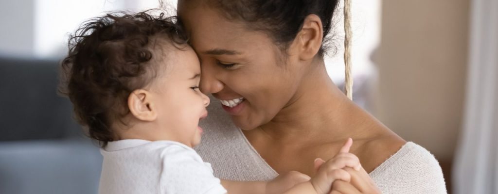 mother hugging little infant or toddler
