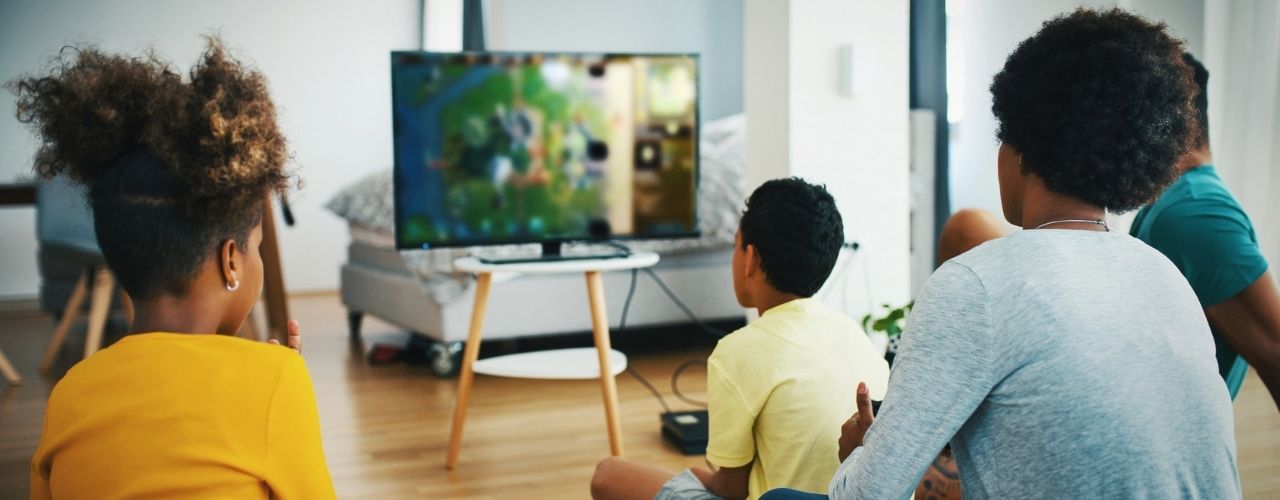Family playing video games at home