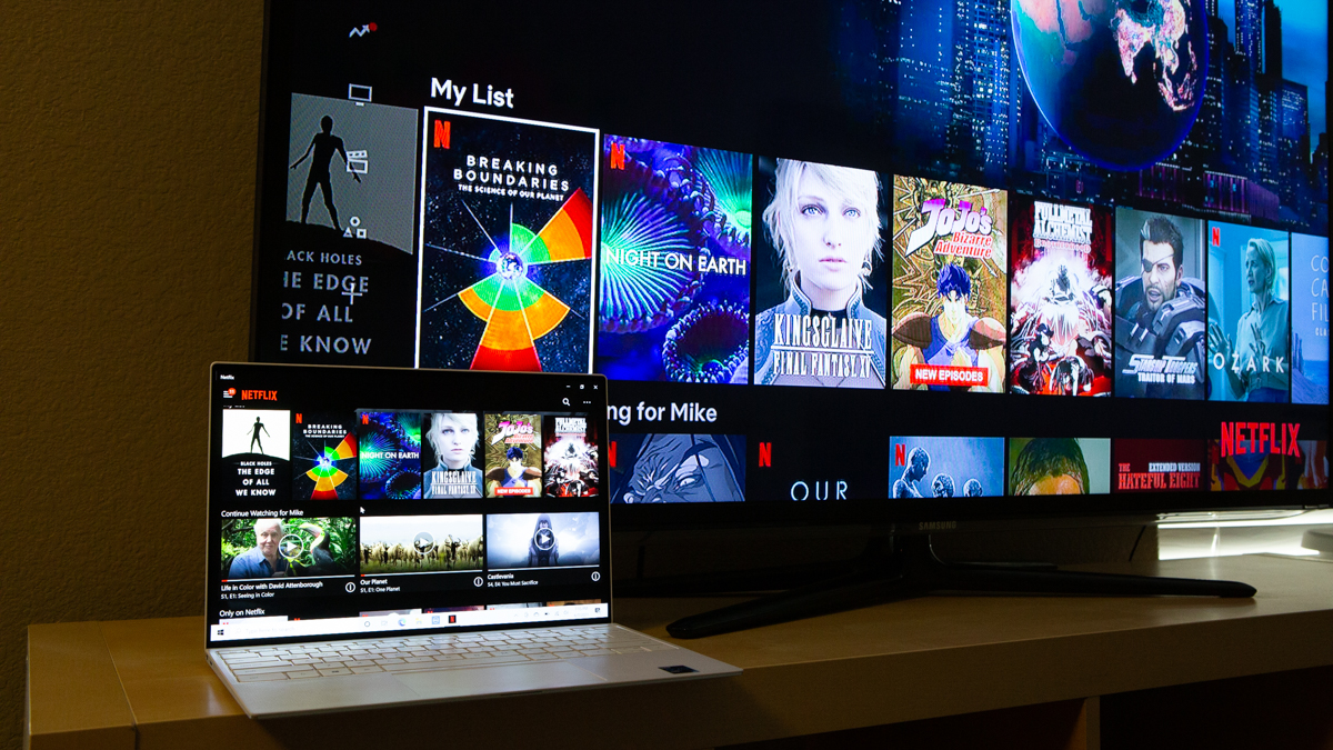 dell xps 13 laptop next to TV