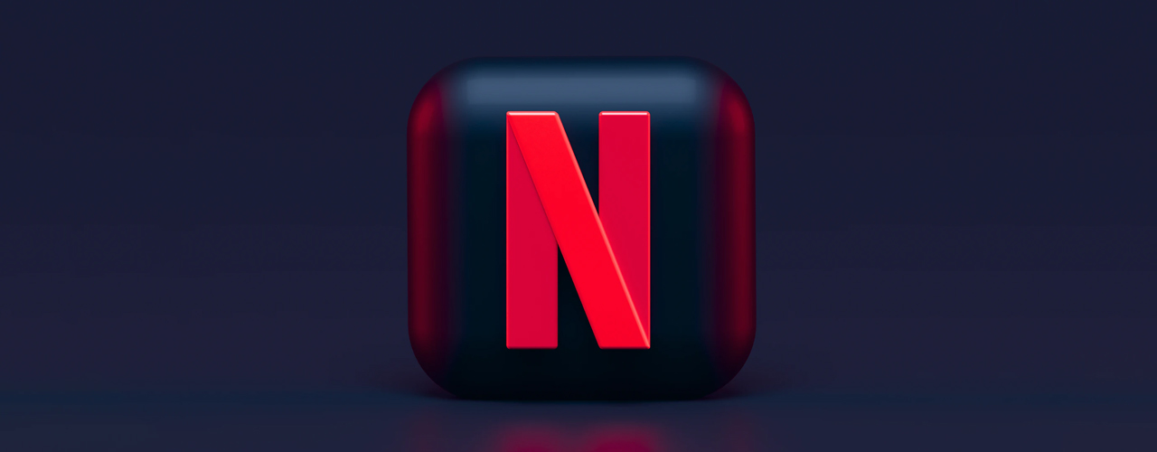 Netflix logo on pill bottle on blue background