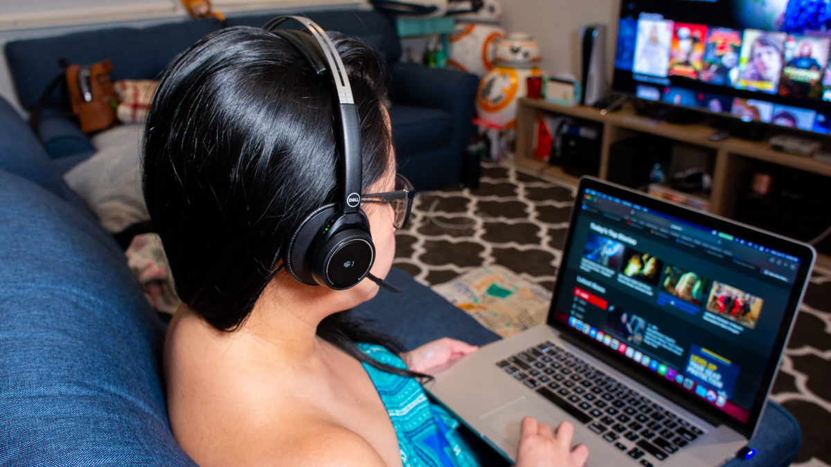 Person using Dell premier wireless anc headset