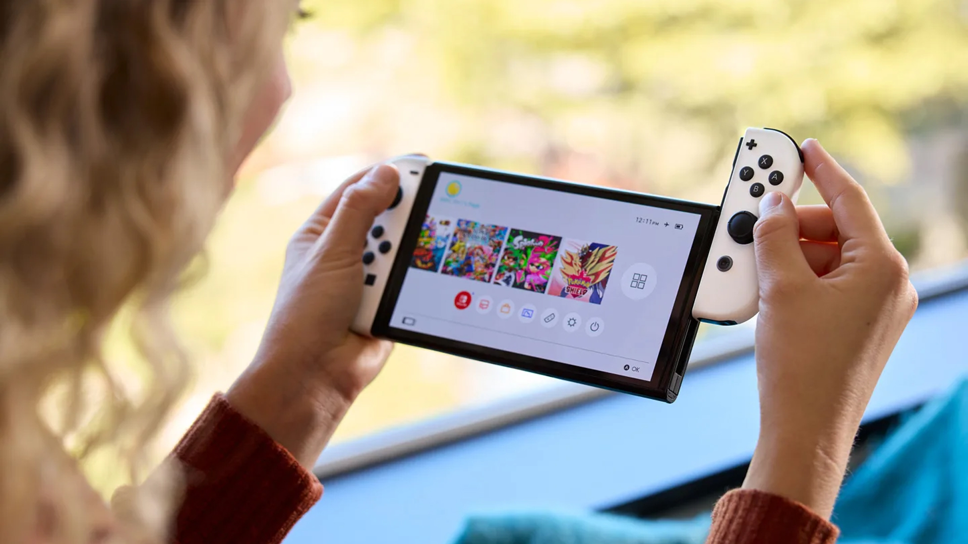 hero woman playing nintendo switch 2021 model oled white black_