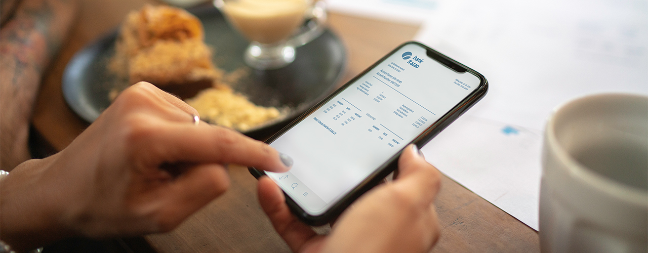 Woman checking account statement of her digital investment on her mobile phone