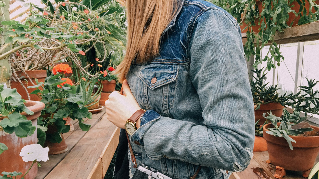 greenhouses and girl looking at plants